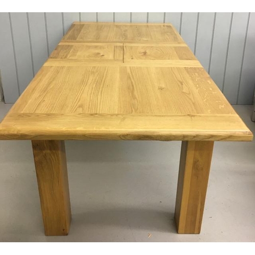 3 - A high-quality, solid light oak extending dining table, in an excellent condition. Extension leaf ho... 