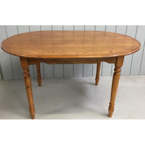 7 - A reproduction, Ercol-style, dining table. Dimensions(cm) H78, W137, D92.