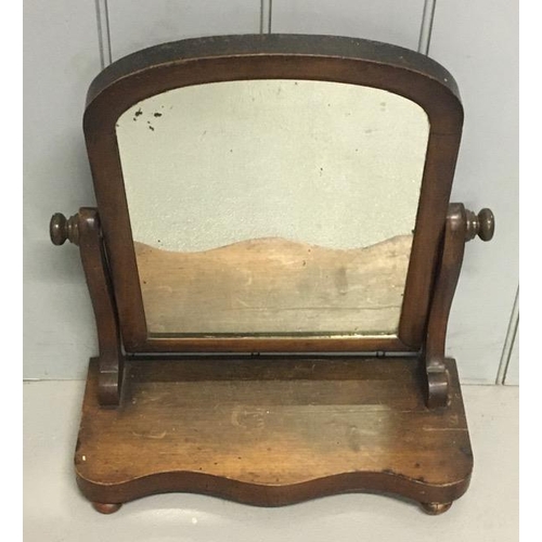 181 - A mahogany, table-top swing mirror. Dimensions(cm) H54, W48, D20.