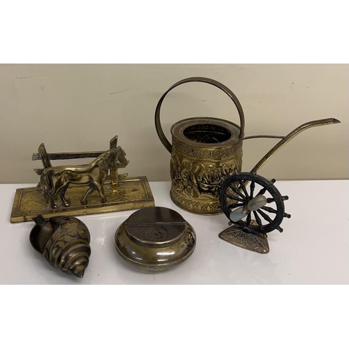 468 - A small collection of 5 brass items. Includes a seashell, ship wheel timer, tobacco holder and a wat... 