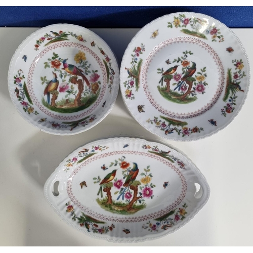 531 - A continental dinnerware set of 'Victoria' bowls, dishes & two boat-shaped platters. A recurrent tro... 