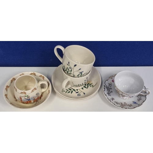 547C - An eclectic assortment of cups and saucers, most notably an early Emma Bridgewater hand-painted 'Wat... 