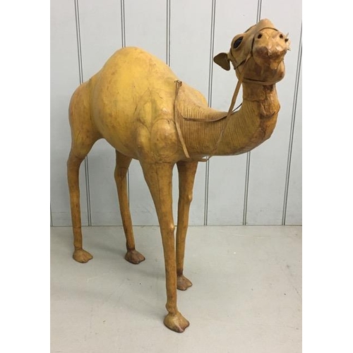 700 - A rare leather-clad, sculptured Camel figure, by Liberty of London. Likely purchased as a decorative... 