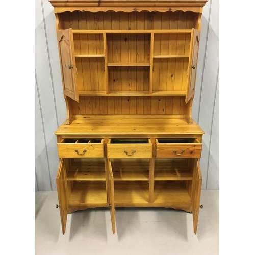 53A - A solid pine Welsh Dresser. Top half features a plate shelf, over double cupboard & display shelf. B... 