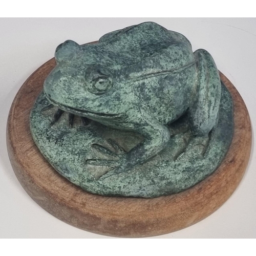 466 - A heavy, verdigris bronze frog figure, mounted on a wooden plinth. Signed, with a maker's mark 'JC'.... 