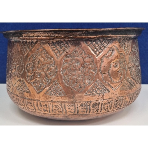 471 - A repousse decorated, Eastern copper jardinière/ large pot. Floral & portrait motif, with a hand-ham... 