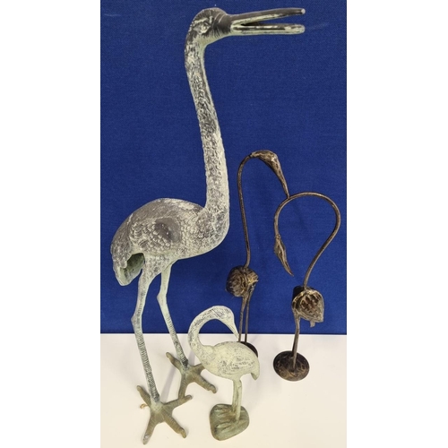 473 - Four mixed metal flamingo/stork outdoor ornaments. The heavier pair made of cast metal. The tallest ... 