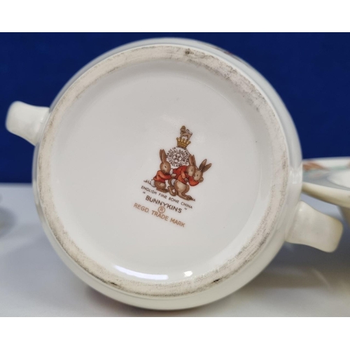 599 - A three-piece set of 'Royal Doulton' 'Bunnykins' nursery ware. Consists of a double handled cup, bow... 