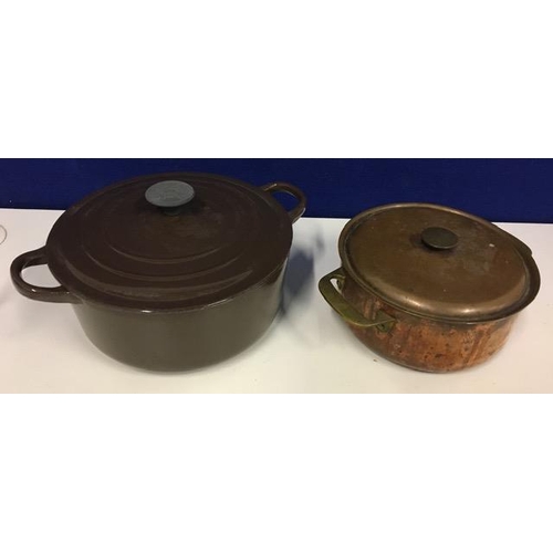 684 - A 'Le Creuset', brown cast iron casserole pot, size D, together with a copper casserole dish.