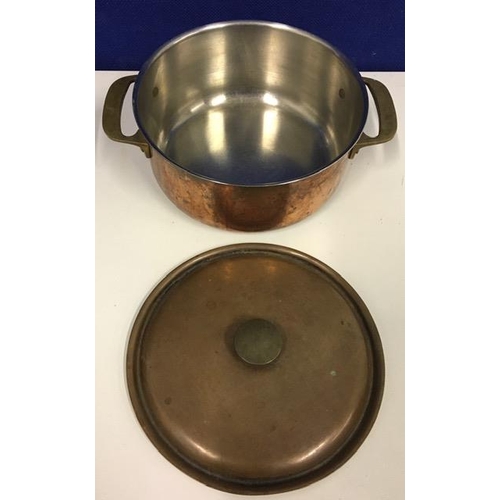 684 - A 'Le Creuset', brown cast iron casserole pot, size D, together with a copper casserole dish.