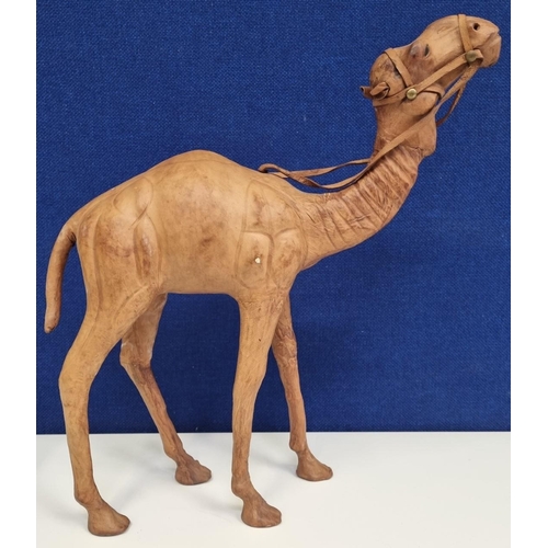 701 - A smaller leather clad decorative camel, likely 'Liberty of London', c.1920's/30's. Height 34cm.