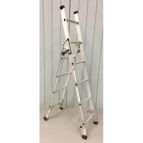 713 - An aluminium combination ladder. 95kg weight capacity. Converts from a 6-rung step ladder (c.6ft len... 