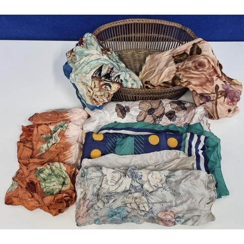 716 - An assortment of six vintage ladies scarves. Some hand-hemmed, one 'Jacqmar', together with a wicker... 