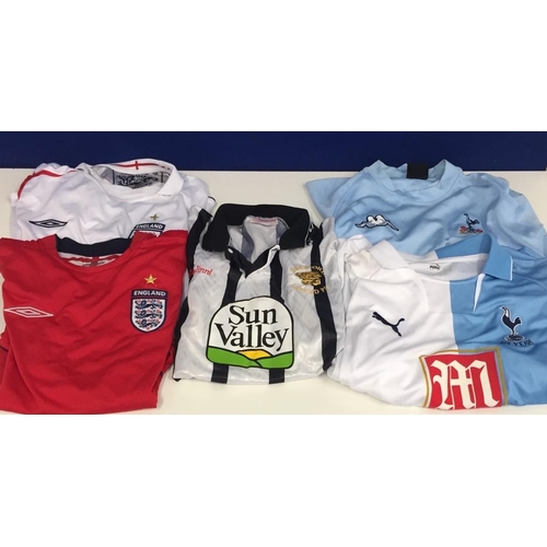 729 - A collection of football shirts. Two England (red & white, size L), Hereford United (38/40), Puma Au... 