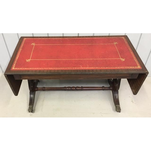 31 - A regency style, mahogany sofa table, with inset red leather top & two extending leaves. Dimensions(... 