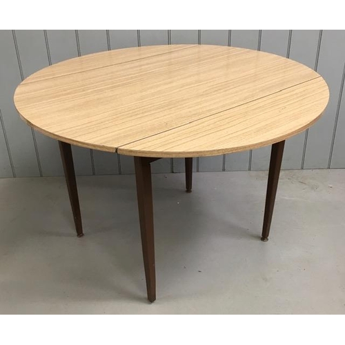 32 - A vintage, drop-leaf, formica dining table. Dimensions(cm) H74, W112, D70/112.