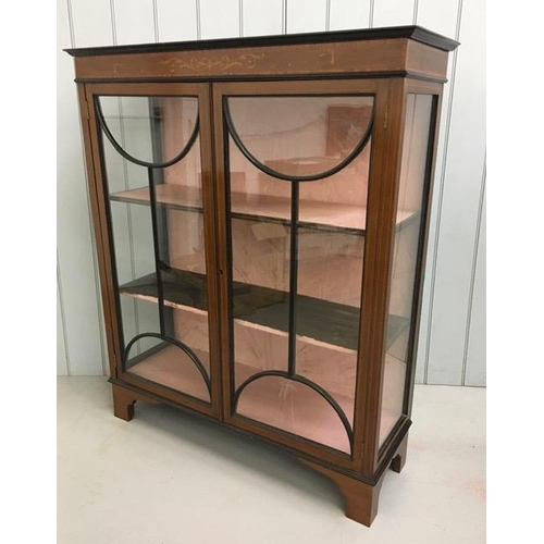 44 - An Edwardian, inlaid mahogany, glazed bookcase with two internal shelves. No key present & one pane ... 