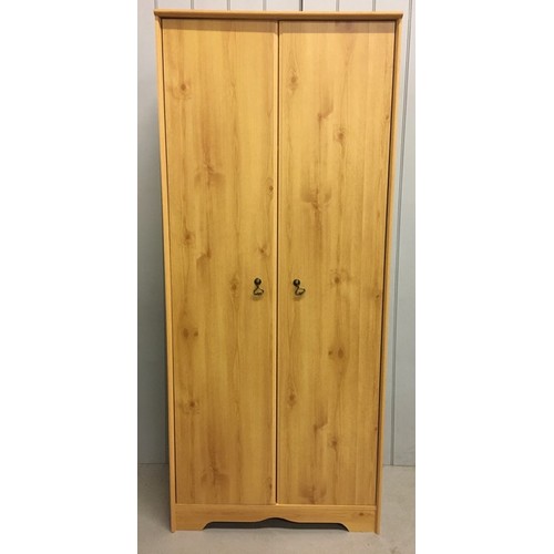 52 - A pine coloured, contemporary double wardrobe.
Dimensions(cm) H184, W79, D48.