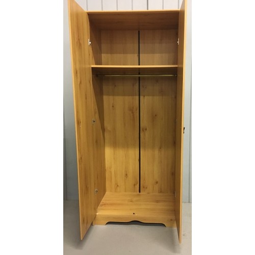 52 - A pine coloured, contemporary double wardrobe.
Dimensions(cm) H184, W79, D48.