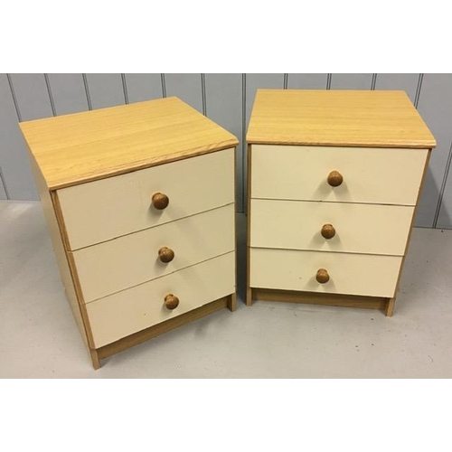 63 - A pair of cream/beech wood effect, three-drawer bedroom chests. Dimensions(cm) H60, W45, D40.