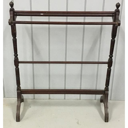 64 - An early 20th century mahogany towel rail. Dimensions(cm) H99, W83, D35.