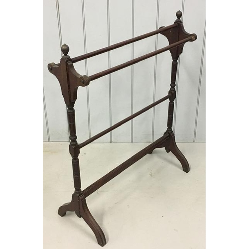 64 - An early 20th century mahogany towel rail. Dimensions(cm) H99, W83, D35.