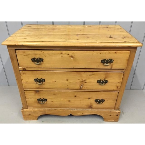 66 - An antique, solid pine chest of three drawers, with brass handles. Dimensions(cm) H78, W92, D49.