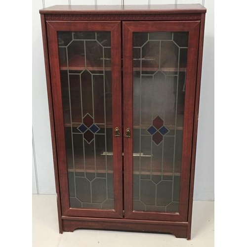 79 - A reproduction glazed bookcase, with mock stained glass doors & three internal shelves. Dimensions(c... 