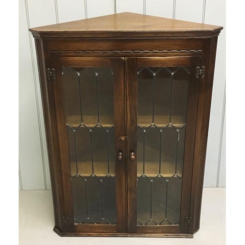 82 - An oak, glazed corner display bookcase, by Bevan Funnell. Ltd. Dimensions(cm) H108, W80, D45.