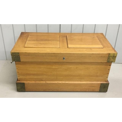 85 - A brass mounted, camphor military campaign chest. Hinged lid with walnut panels. Fully fitted interi... 