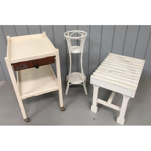 91 - A mixed lot of three items of white painted furniture. Includes a luggage stand, tea trolley & plant... 