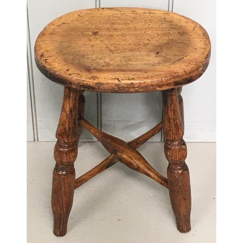 96 - A 19th century oak stool, with oval top & cross-stretcher. Dimensions(cm) H39, W33, D25.