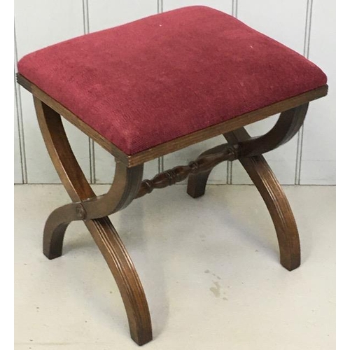 99 - An Edwardian x-frame stool, upholstered in a claret coloured fabric. Dimensions(cm) H48, W44, D37.