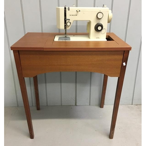 103 - A vintage, electric Singer sewing machine (model 5102) with original cabinet/table. Untested. Dimens... 