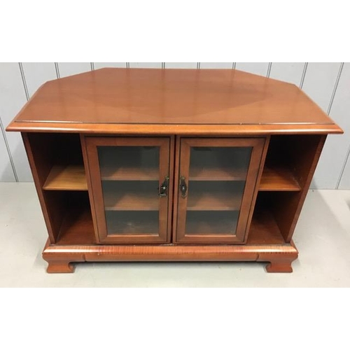 106 - A cherry-coloured, corner TV stand, by White & Newton. Features glazed doors, with two media shelves... 