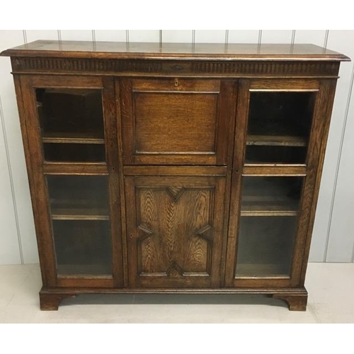 109 - An Edwardian oak, part glazed bureau. Key present. Dimensions(cm) H118, W128, D41.