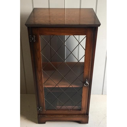 134A - A priory-style, oak hi-fi cabinet, with glazed/leaded door. Dimensions(cm) H101, W53, D46