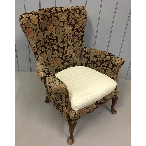 139 - A vintage wingback chair. Comes complete with a set of cream coloured fabric covers. Dimensions(cm) ... 