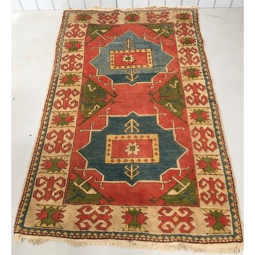 190 - A Caucasian-style rug. Length 210cm, width 130cm.