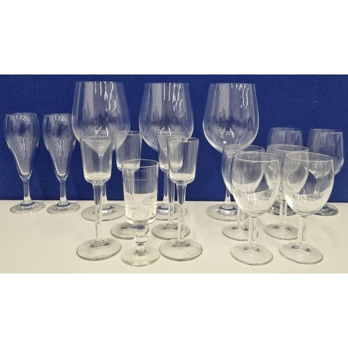 204 - A large quantity of unbranded, clear glassware, to include three substantial wine glasses with delic... 