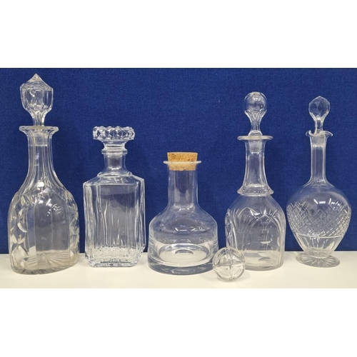 206D - An assortment of glass & crystal decanters, with a spare stopper. To include an attractive, plain cr... 