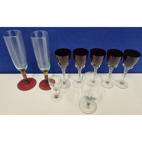 211A - A quantity of drinkware, to include wine glasses & a sherry glass. Five attractive 'ruby' style wine... 