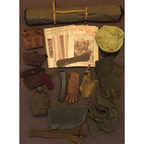 268A - A collection of military items, including, gloves, belts, 13 editions of 'With the Flag to Pretoria'... 