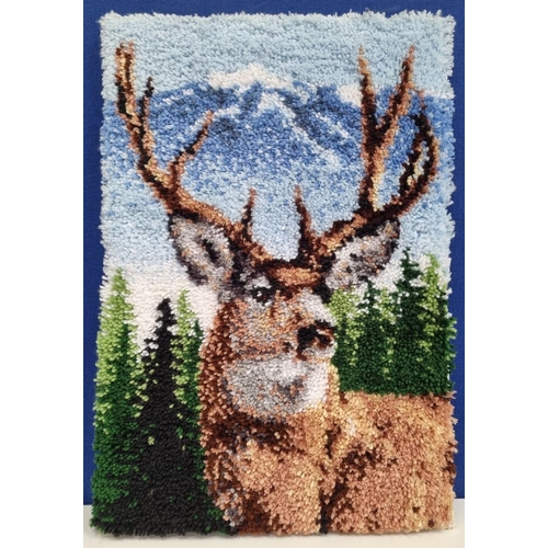 368 - A hand-made latch hook rug, stretched on canvas with a deer/stag theme. Dimensions(cm) H77, W51.