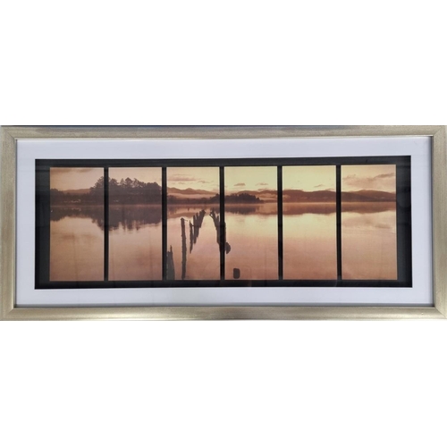 378 - A framed, sunset lake scene print. Framed dimensions(cm) H42, W93.5.