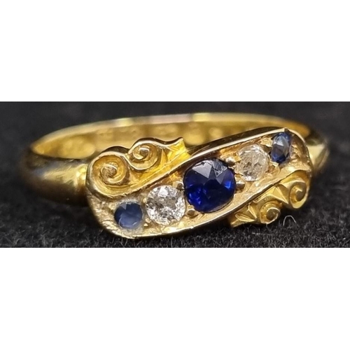 409 - An attractive late Victorian five stone diamond and sapphire ring. Two clean diamonds (approx. 0.08c...
