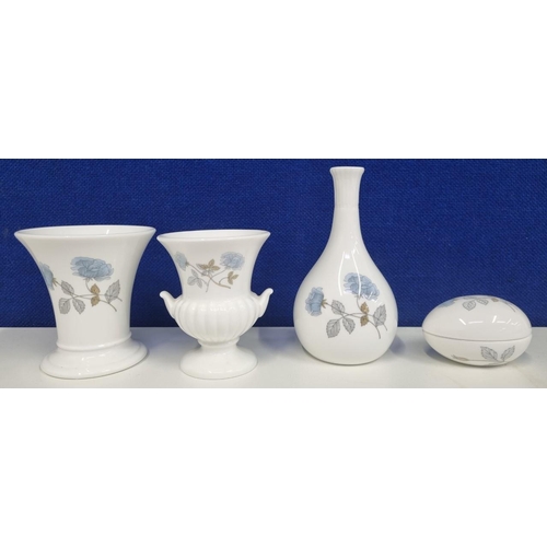 507A - A quantity of 'Wedgwood' 'Ice Rose' pattern ceramics, to include three vases & an egg-shaped trinket... 