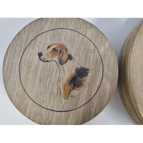 630 - A retro collection of finely hand-painted canine miniatures on five wooden coasters & six mats. Sign... 