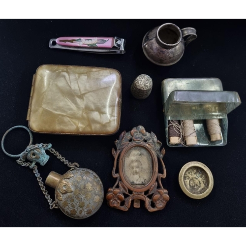 631 - An eclectic mix of smaller antique items to include an 'Art Nouveau' miniature picture frame, sewing... 