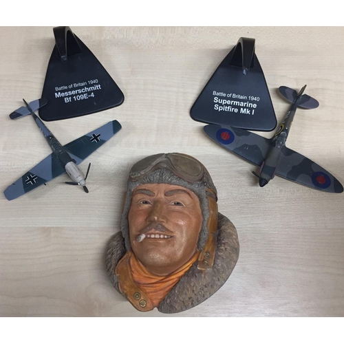 2168 - Atlas Editions model Spitfire & Messerschmitt aircraft, together with a Legends pilot bust.